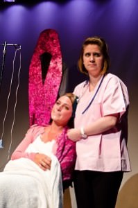 Gracie Jones ( Chelsea) sitting sings the song "A Nurse Named Desiree." Megan Westman (Desiree) is standing. Photo by Betty Adler.
