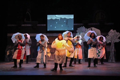 Michael J. Margelos (center) as Patsy leads a tap dance to "Always Look On the Bright Side of Life."