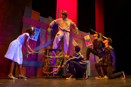 Dorothy (Jessie Hooker) rescues the Scarecrow (Jobari Parker-Namdar) from the Crows (Trevor Schmidt, Stevie Bovo, and Michael Kennedy). Photo by C. King Photography.