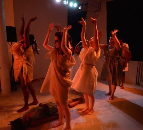 Iphigenia (Paris Brown, floor) and Agamemnon (Dana Woodson, back) while The Chorus (l-r, front to back ): Trustina Fafa Sabah, Sarah Weissman, Ren Pepitone, Katharine Vary, and Andrea Bush) recalls Agamemnon’s fateful trip to the woods. Photo by Britt Olsen-Ecker Photography.