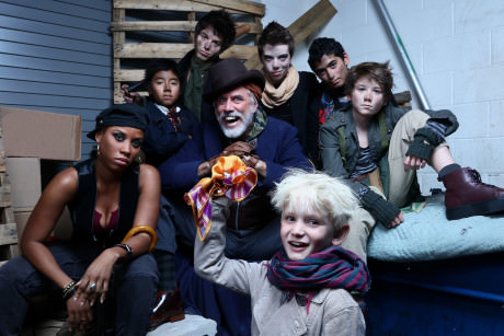 Jake Heston Miller (Oliver) (bottom center) with Eleasha Gamble (Nancy), Jeff McCarthy (Fagin), and members of Fagin’s gang. Photo by Tony Powell.