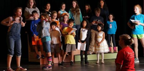 Director Liz Mykietyn (foreground) rehearses a scene with the highly talented group of young people who comprise much of the cast of The Best Christmas Pageant Ever which opens December 9th at the James Lee Community Center Theater. Photo by Rob Cuevas, Providence Players