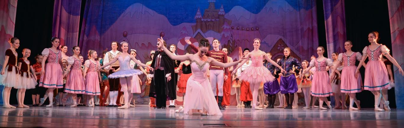 Elizabeth Fittro takes a final bow as Clara with her Prince, Diego Sosa and the cast behind her. Photo by Nick Eckert.