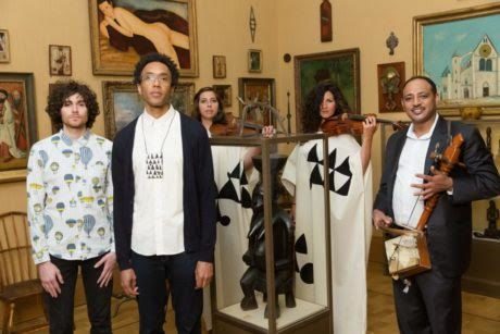 Ben Lee, Jace Clayton, and Gezachew Habtemariam (front), with violinists from the Prometheus Chamber Orchestra (behind), in ‘Room 21’ at the Barnes Foundation. Photo by Max Lakner.