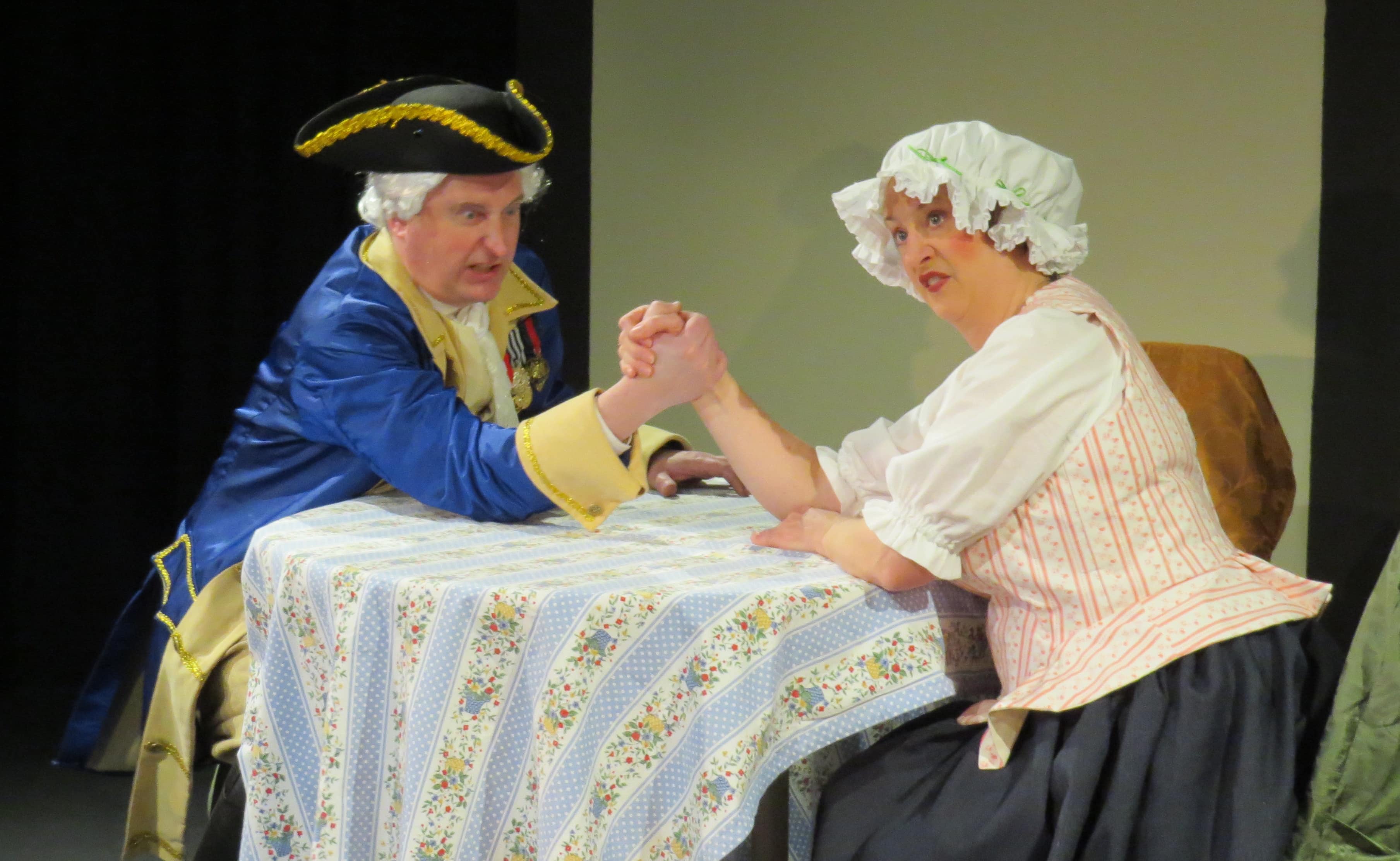 Freytag (John Morogiello) negotiates with Frau Schmidt (Rebecca A. Herron). Photo by Elizabeth Kemmerer.