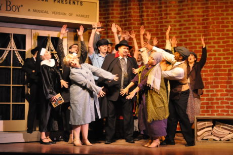 Steve Cairns (center) as Max Bialystock, with the Ensemble in The Little Theatre of Alexandria's production of 'The Producers.' Photo by Matthew Randall.